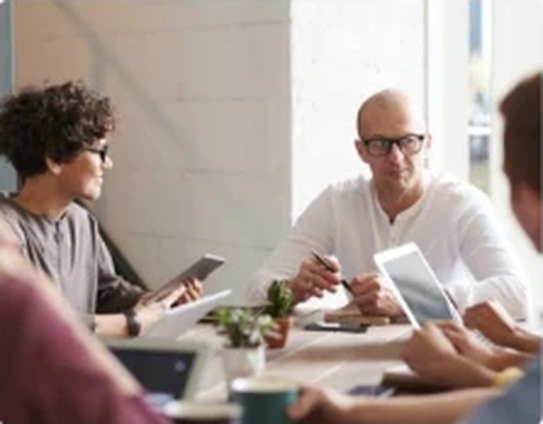 Team discussing a project around a table